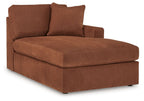 Brown corner chaise with cushioned seat and two back pillows