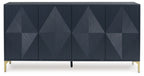Dark blue accent cabinet front with diamond geometric door panels and gold-tone legs