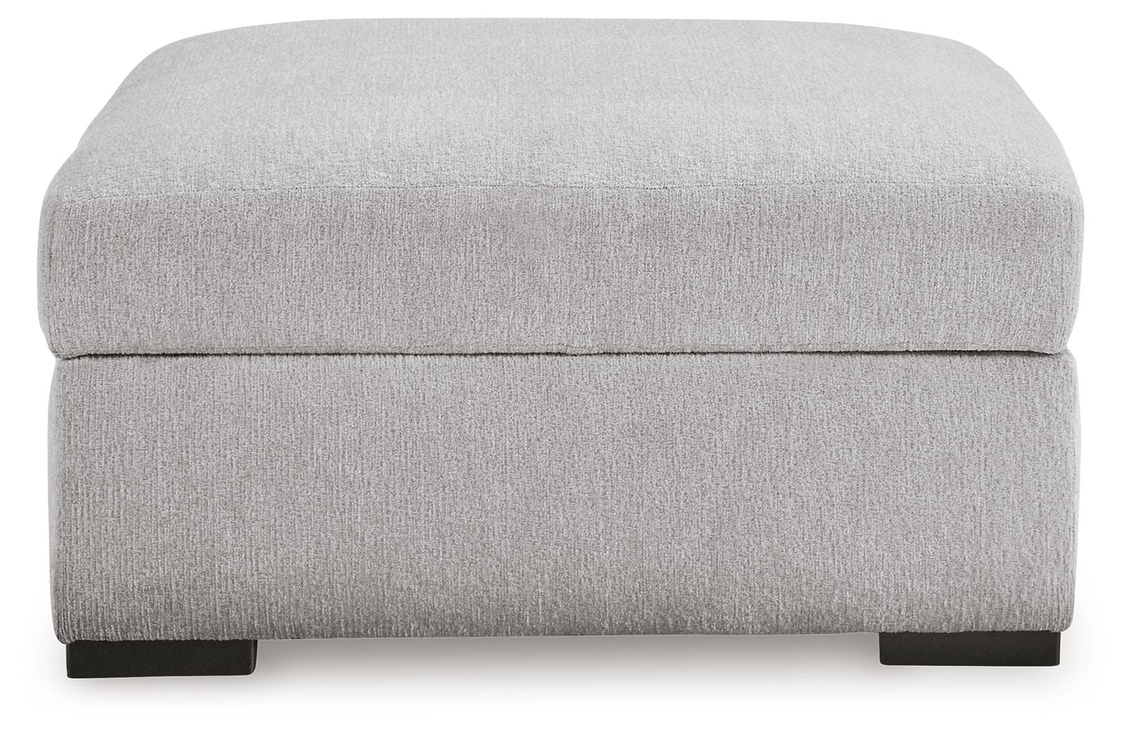 Light gray upholstered storage ottoman with hinged lid and dark feet