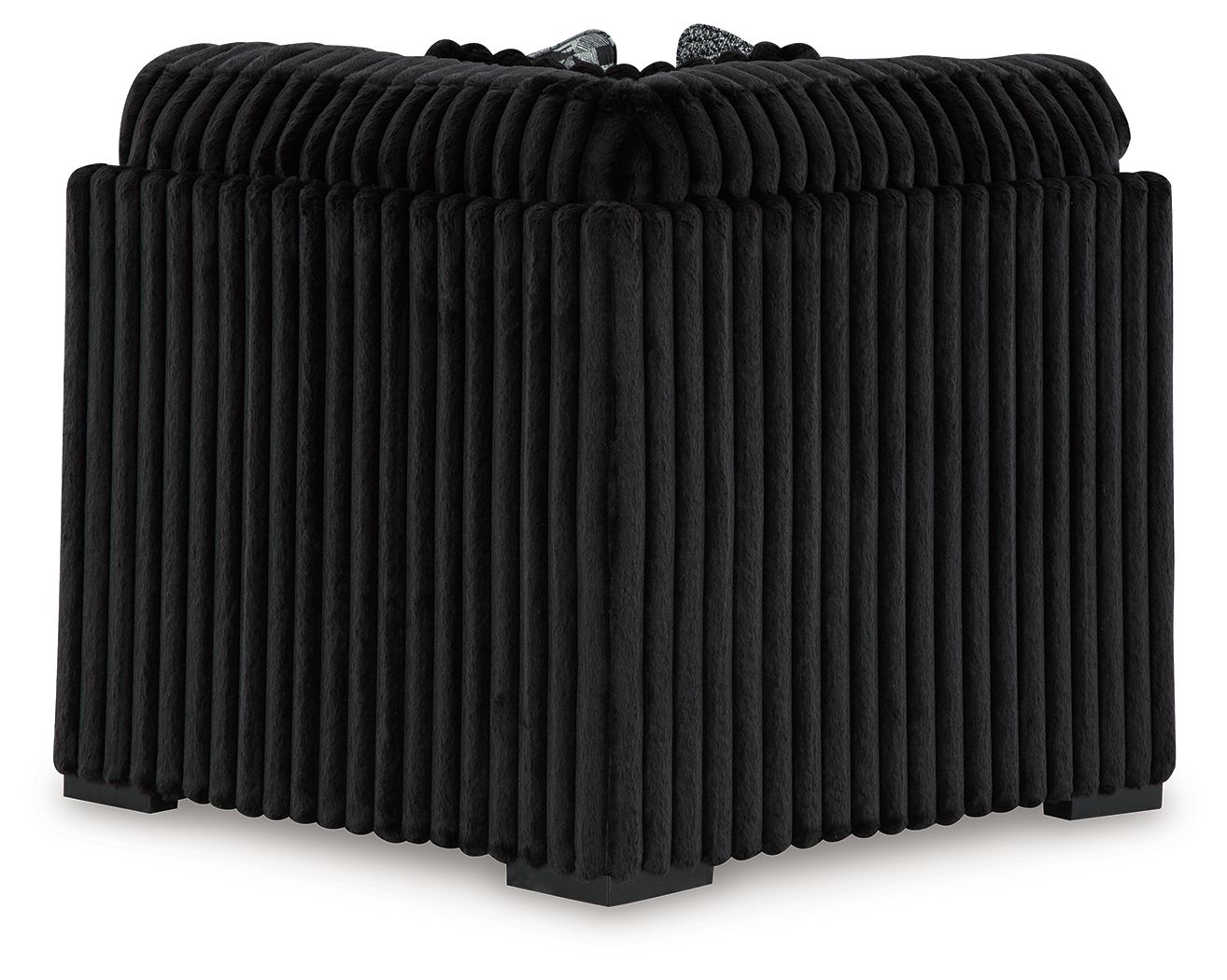 Black ribbed wedge sofa section with rounded back and thick armrests
