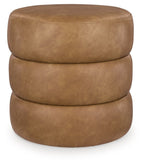 Light brown swivel accent ottoman with round padded top and stacked cylindrical base.