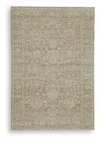 Light brown flatweave rug with subtle distressed texture and mottled pattern