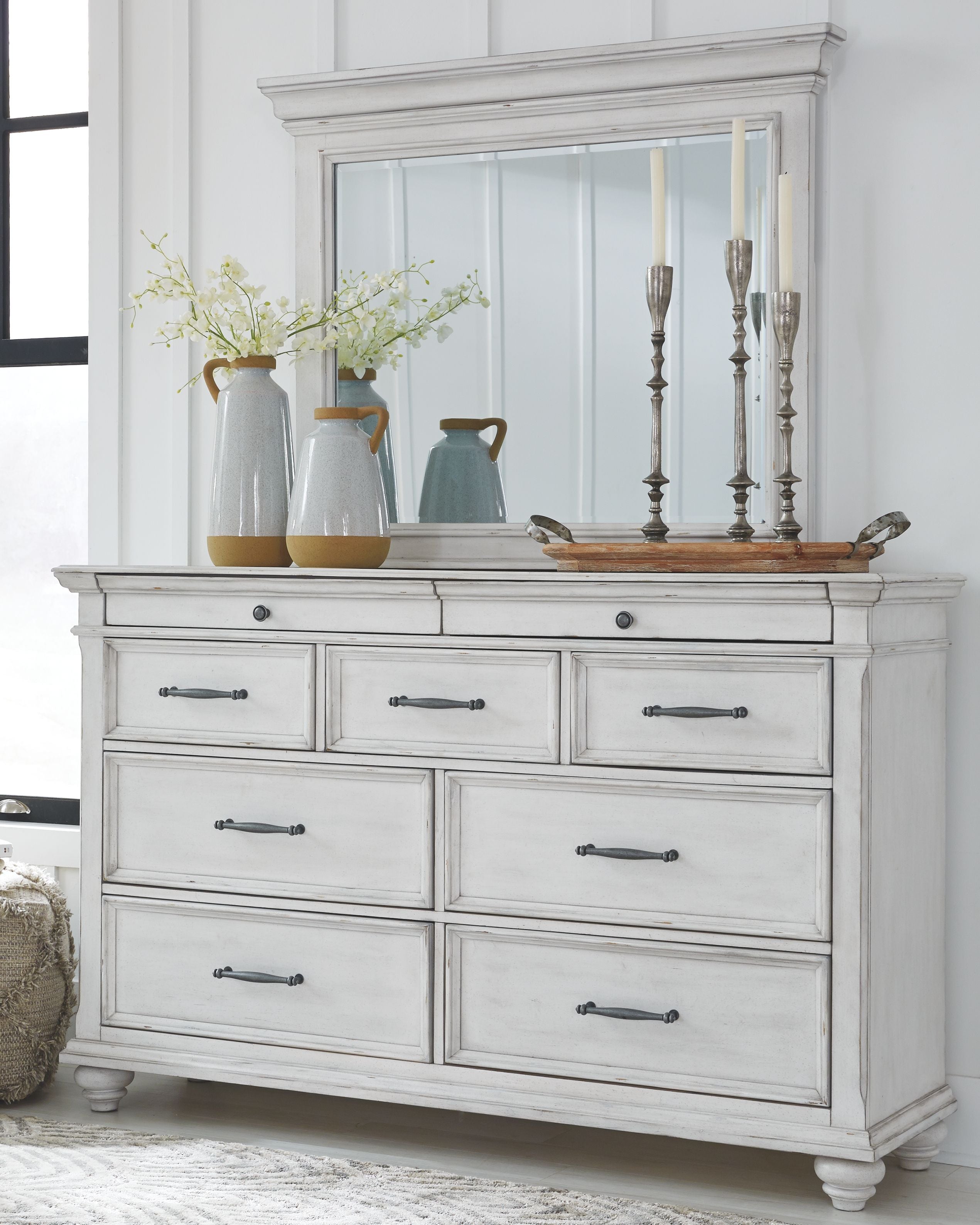 Whitewash dresser with mirror behind, six drawers, and metal bar pulls