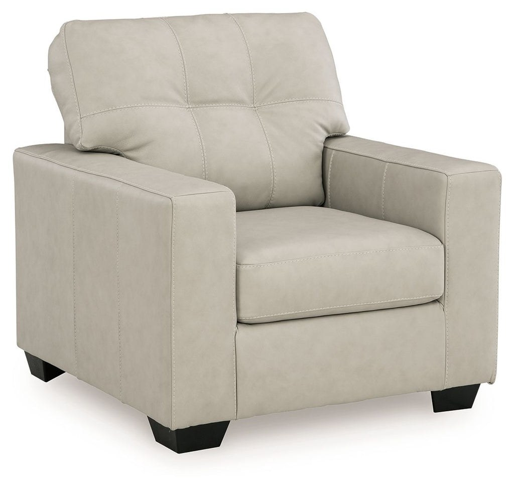Beige upholstered accent chair with square arms and padded back, front three-quarter view