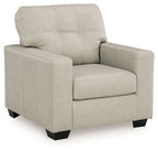 Beige upholstered accent chair with square arms and padded back, front three-quarter view