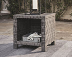 Gray square end table with woven rattan frame and dark open center