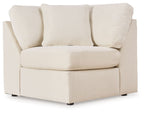 Upholstered wedge sectional chair in oyster beige with wide arms and block legs