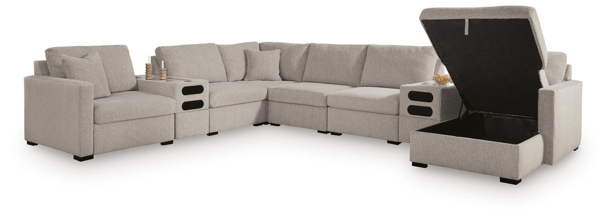 Gray sectional sofa with open lift-up chaises showing storage compartments
