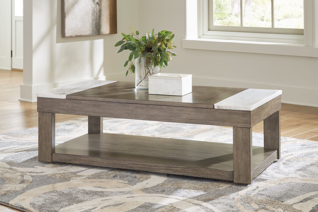 Grayish brown lift-top cocktail table with white side panels, styled with vase