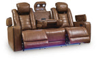 Brown leather reclining sofa with two center seats, cup holder console, and adjustable headrests