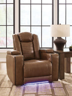 Brown recliner chair with adjustable headrest, padded arms, and cushioned seat