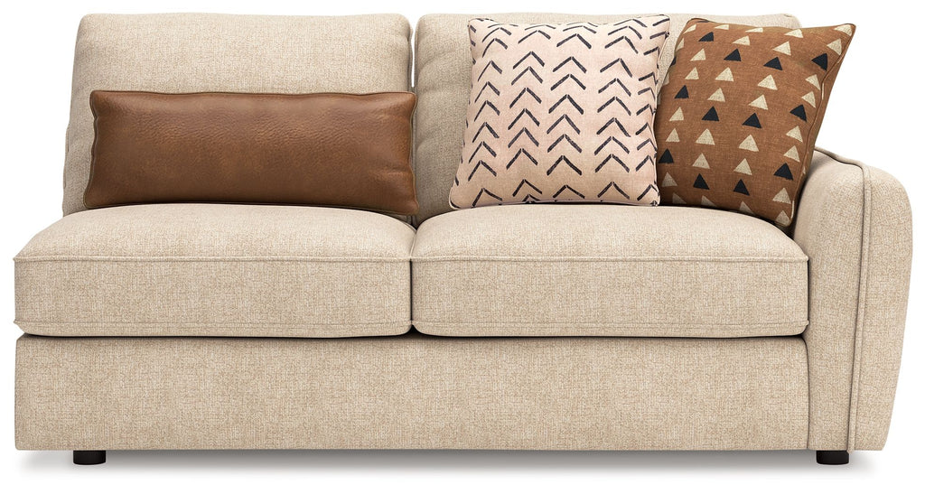 Seyler RAF sand sofa with two seat cushions, thick arms, and three decorative pillows.