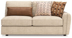 Seyler RAF sand sofa with two seat cushions, thick arms, and three decorative pillows.