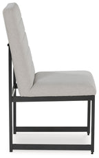 Upholstered dining side chair, angled view, padded backrest and dark frame