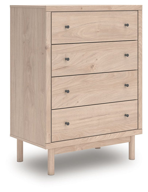 Four-drawer chest with light tan wood finish and black round knobs
