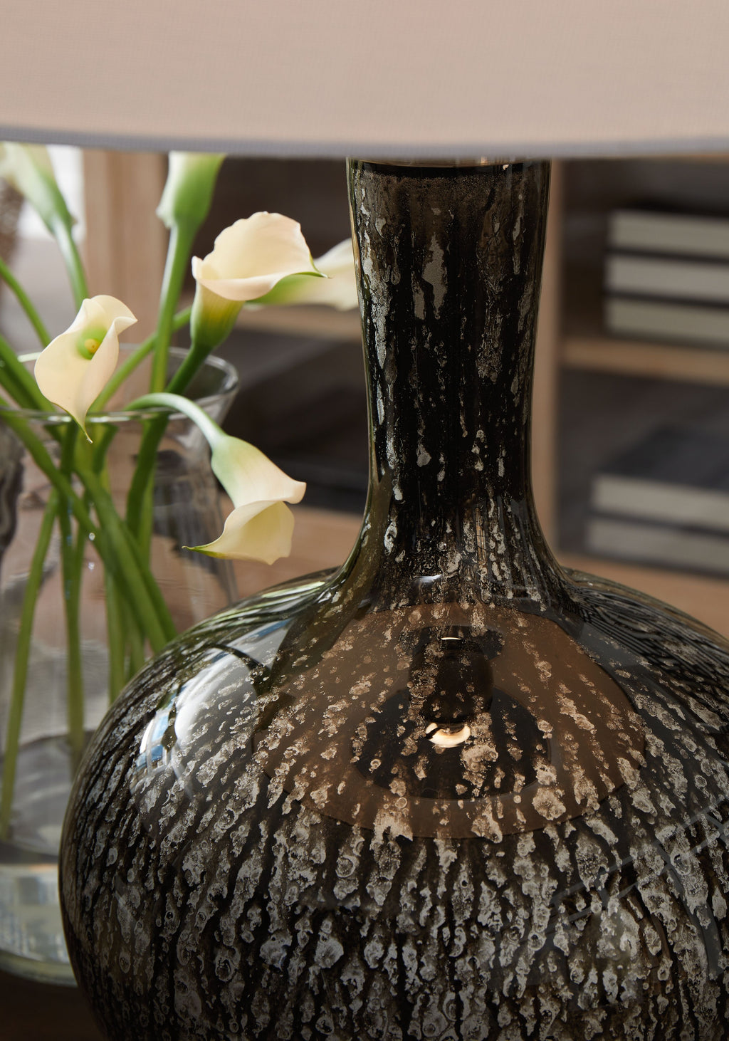 Textured antique black glass lamp base with narrow neck and round body