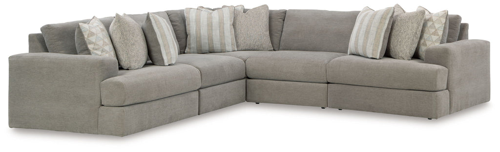Gray corner sectional sofa with chaise seats and multiple accent pillows