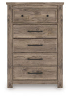 Five-drawer chest in rustic light brown wood with metal pulls and inset top drawer