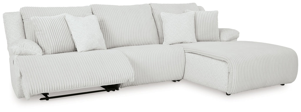 Light gray reclining sectional sofa with chaise and striped seat and back cushions