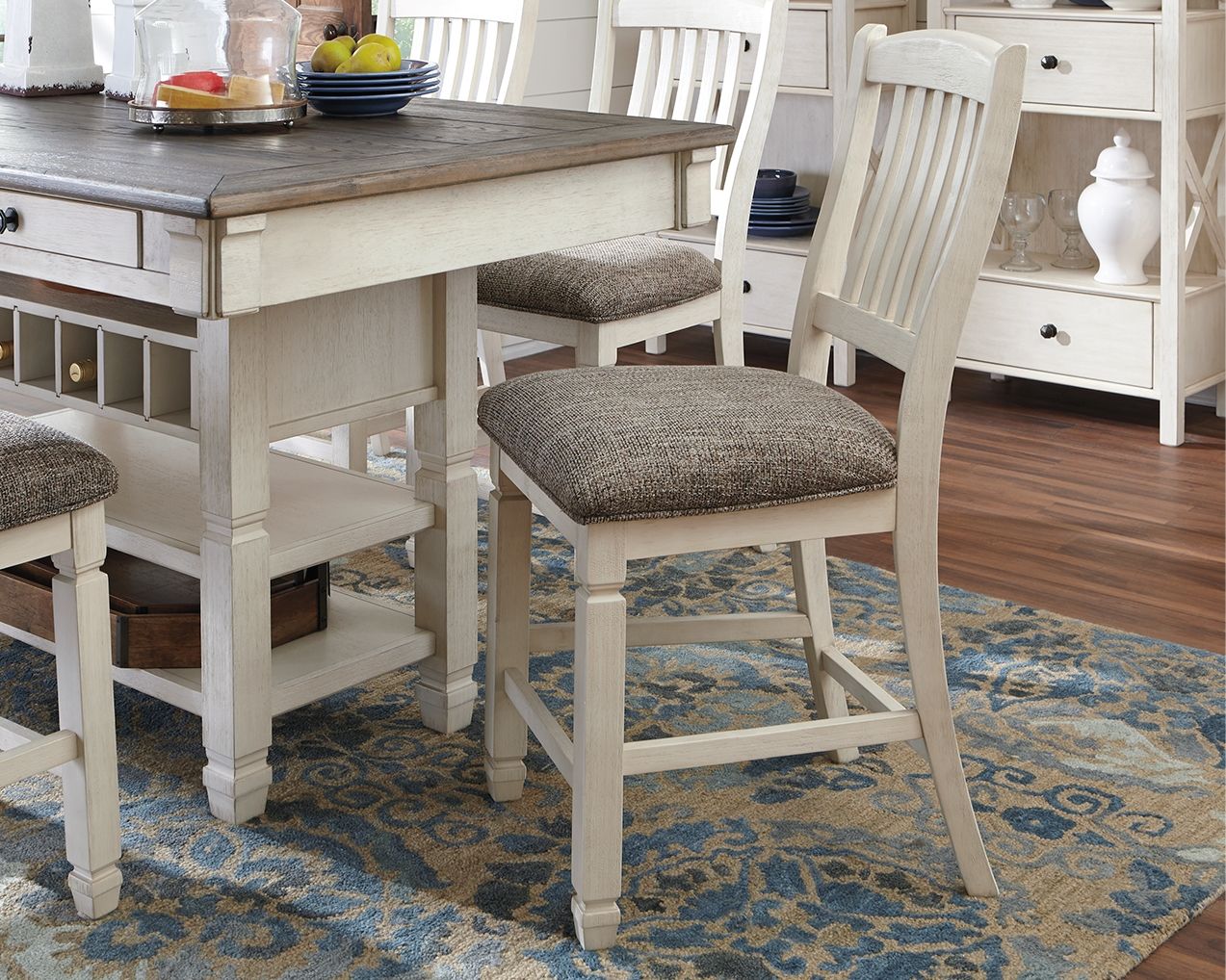Beige upholstered barstool with slatted back and padded dark fabric seat