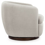 Light beige swivel accent chair side view with rounded back and dark brown base