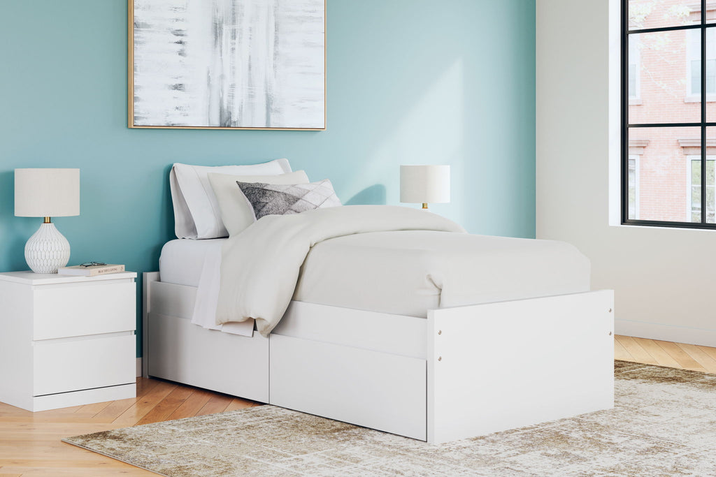 White platform bed with headboard and three-panel side storage drawers