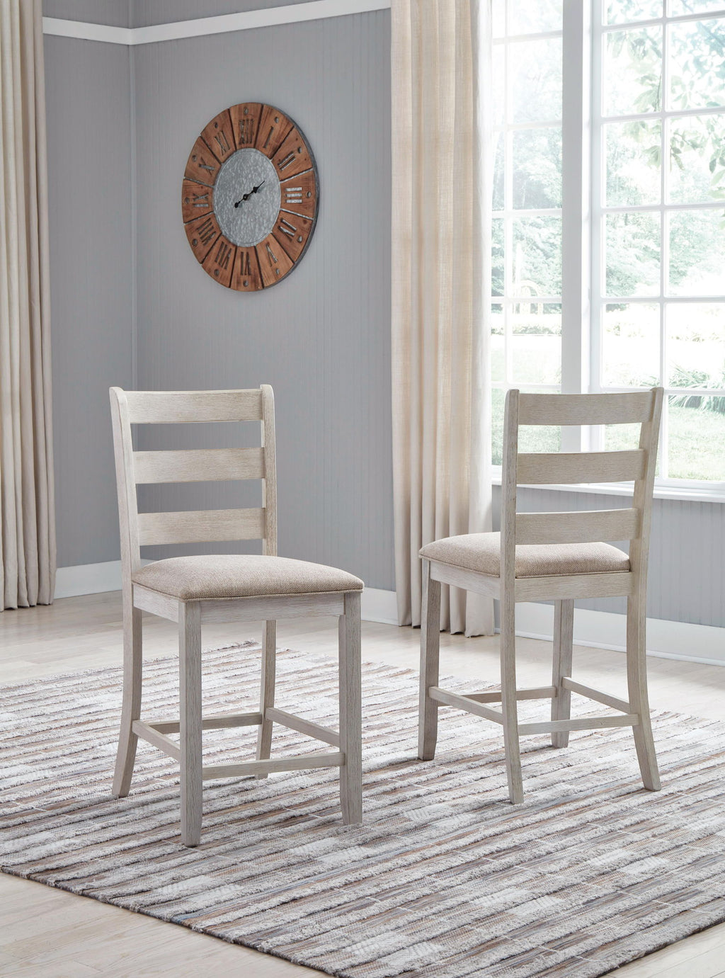 Upholstered barstool with beige padded seat and white ladder backrest, side view