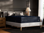 DreamCloud Blue hybrid mattress on a bed frame with visible legs