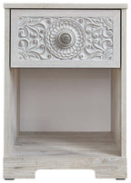 Whitewash night stand with carved metal-look medallion on drawer front and open base