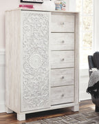 Whitewashed dressing chest with carved front doors and drawer fronts