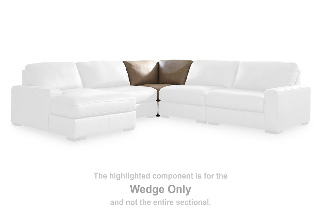 Wedge-only upholstered sofa section with seat and back cushions, light beige fabric