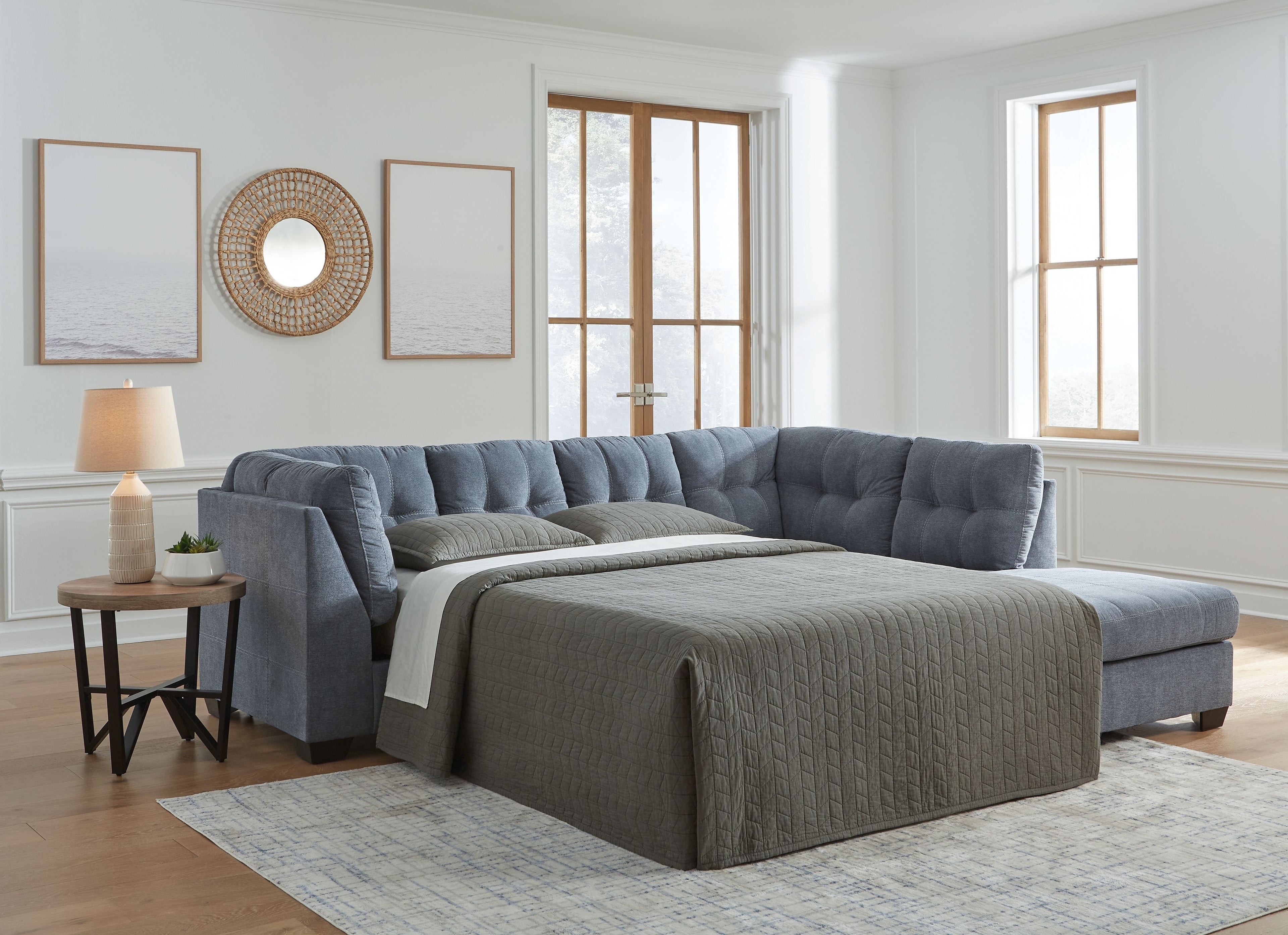Dark gray sleeper sectional sofa with chaise and unfolded sleeper bed