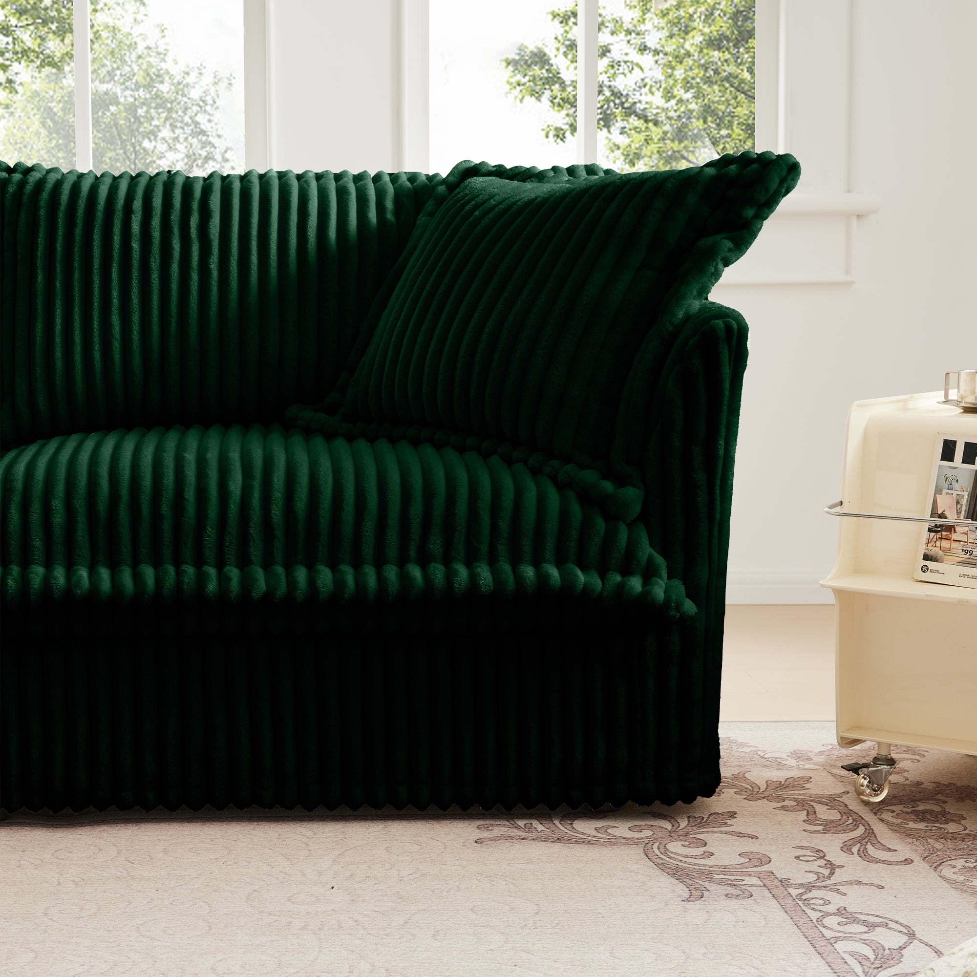 Green corduroy sectional sofa with rounded arms and deep cushioned backrest
