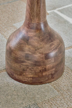 Round accent table base with stacked wood panels and flared pedestal, medium brown