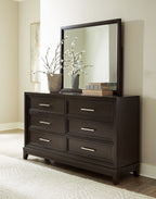 Dark grayish brown dresser with framed rectangular mirror and six drawers