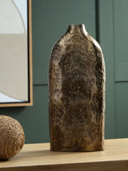 Wallmond vase in gold-brown distressed finish with tall bottle shape and narrow opening.