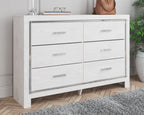White dresser with mirror, framed mirror above six drawers with bar pulls
