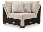 Upholstered wedge armchair with light beige fabric and two accent pillows