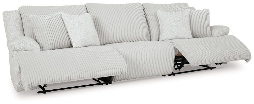 Light gray reclining sectional sofa with striped upholstery and visible recline mechanism