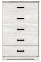 Whitewash drawer chest with four visible drawers and dark bar handles, front close-up