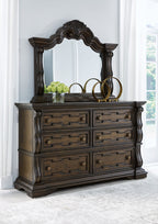 Dark brown dresser with arched mirror, six drawers, decorative knobs and legs