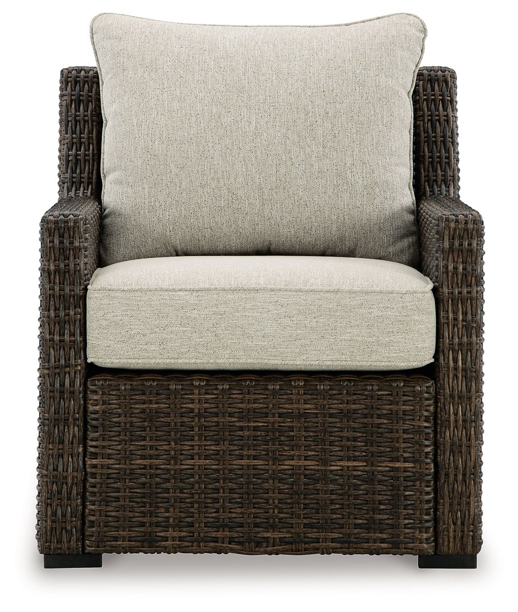 Brown woven armchair with light beige seat cushion and large back cushion