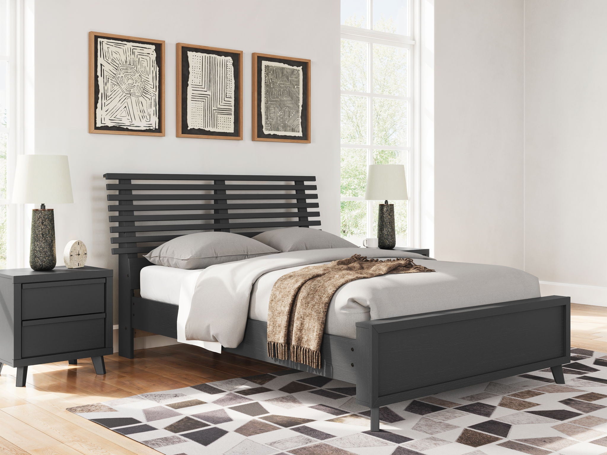 Black full slat panel bed with pillows, throw blanket, and slatted headboard