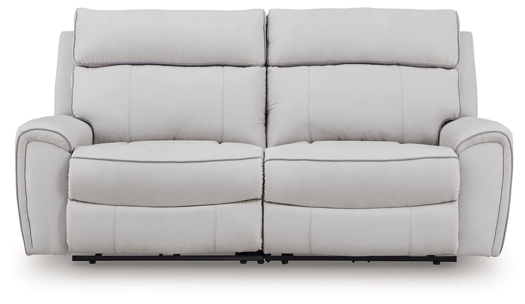 Light gray reclining sectional sofa with padded armrests and two back cushions