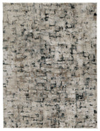 Rectangular area rug with distressed abstract pattern in off-white and dark grey