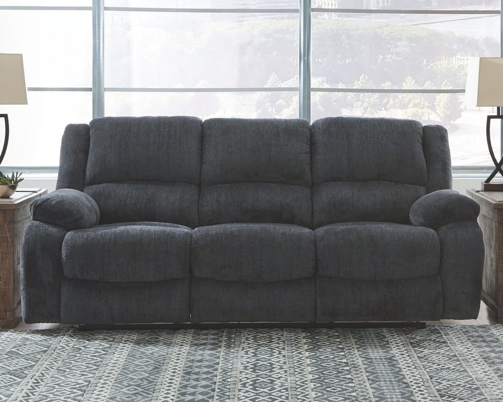 Dark gray reclining sofa with squared cushions and padded track arms