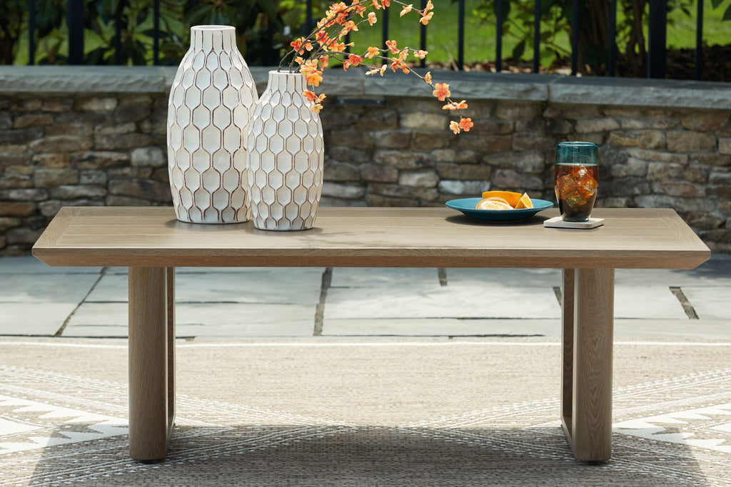 Dark brown rectangular cocktail table with wide top and four block legs