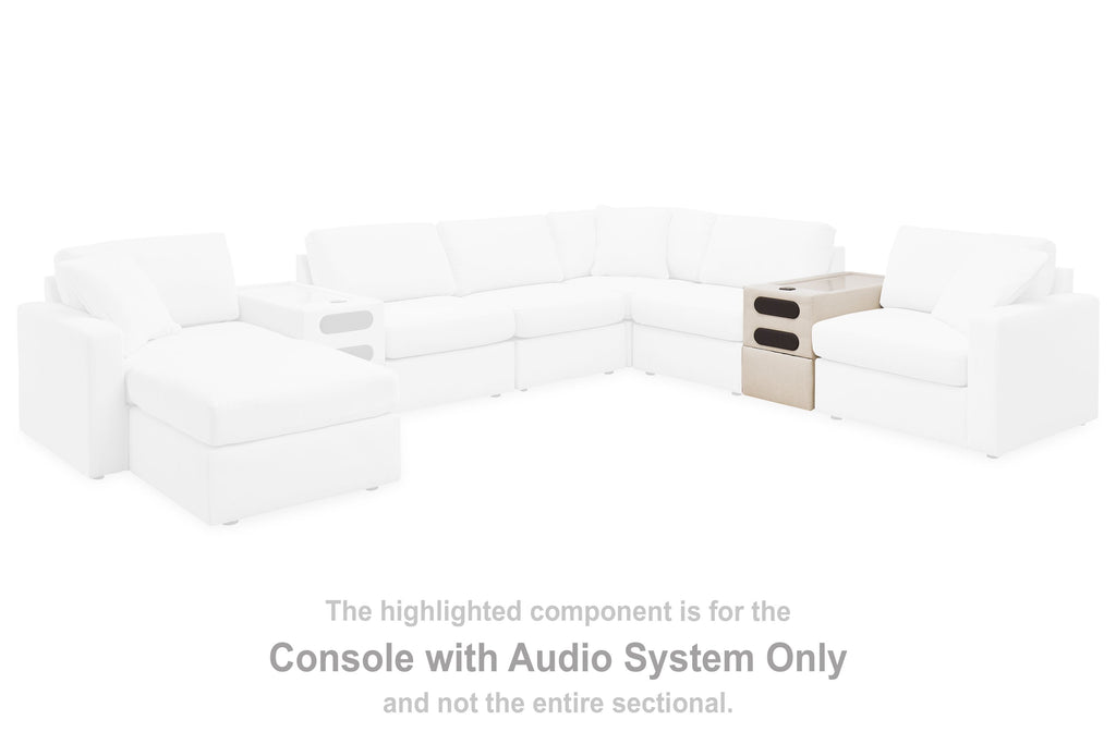 Oyster console with audio system highlighted on white sectional seating