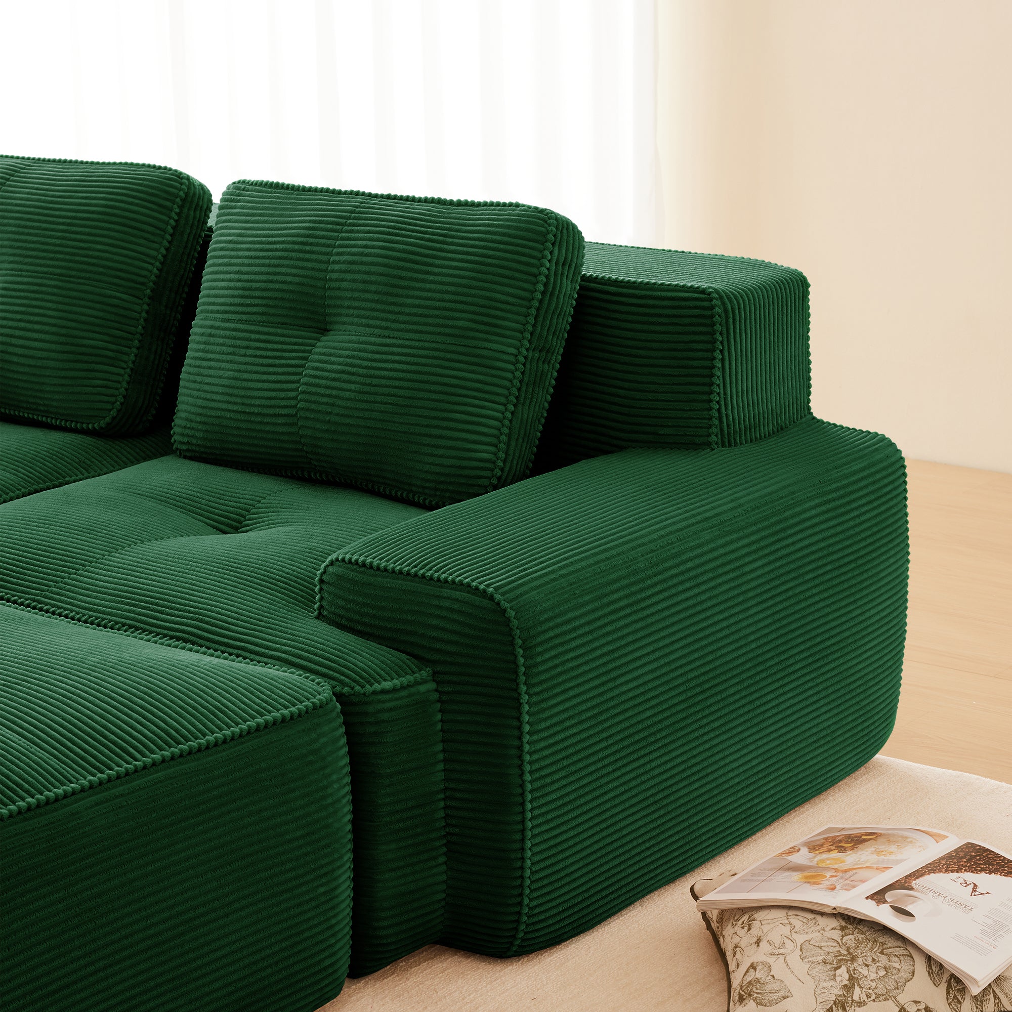 Green corduroy modular sectional sofa arm and seat cushions, ottoman section