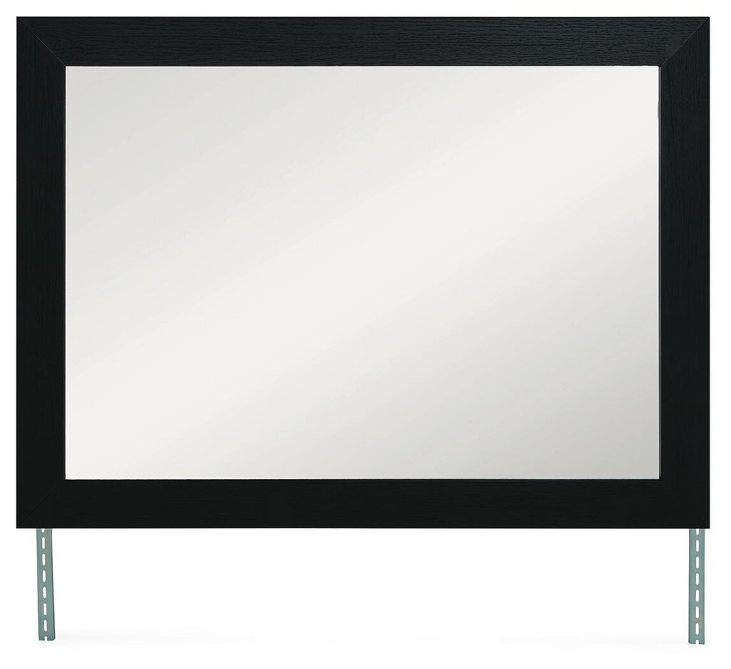 Black rectangular bedroom mirror with dark frame and metal support legs